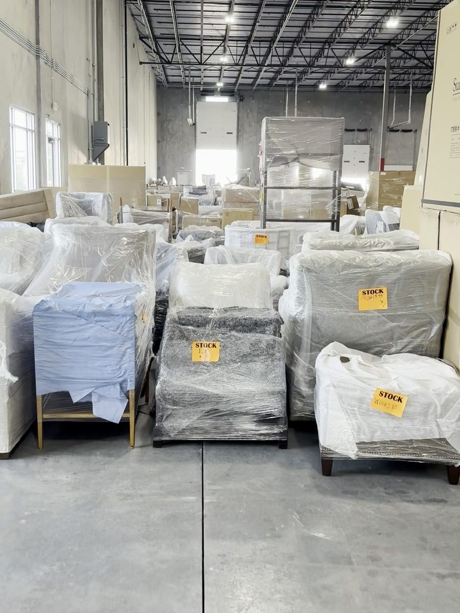 Wrapped and tagged furniture staged on the receiving floor
